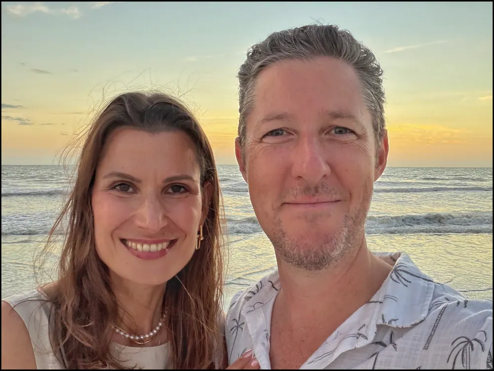 Carmen and Ian on a beach at golden hour