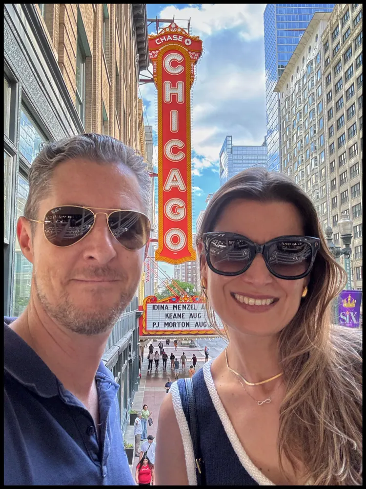 Carmen and Ian under the Chicago Theatre marquee